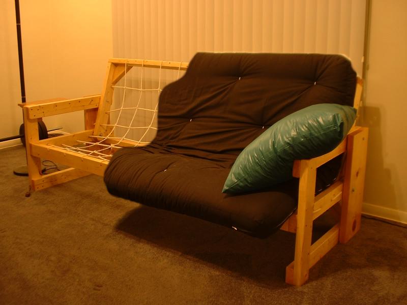 wooden futon with black cushion